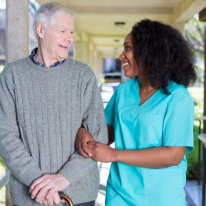 Elderly man with caregiver